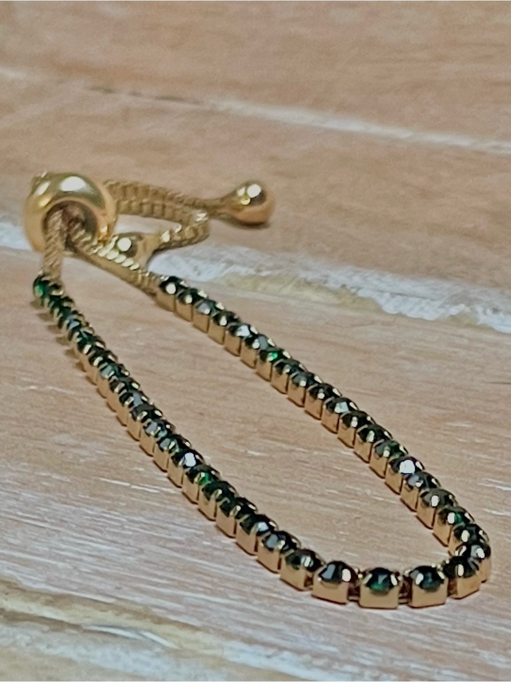 Gold Bracelet with Dark Green Crystal Accents and Adjustable Slider